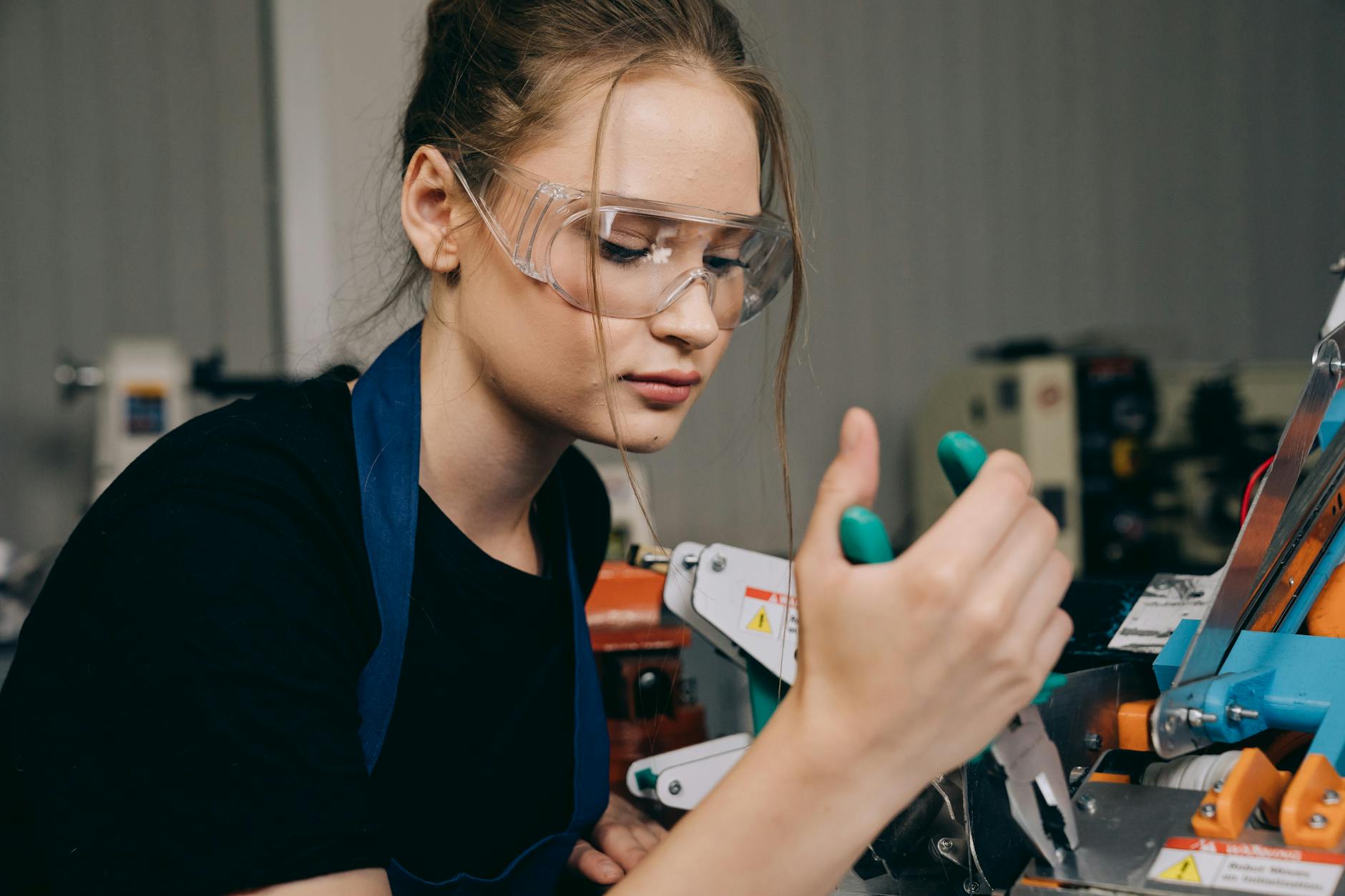 October 25 Schools Newsletter is live 1 a woman using a pliers at work
